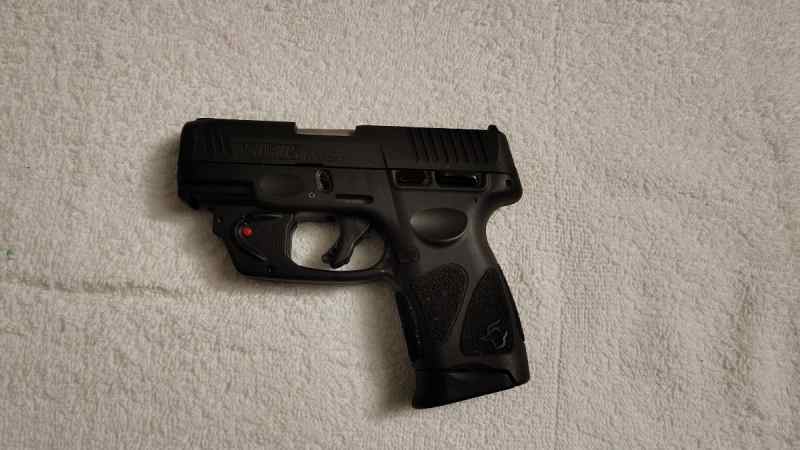 Taurus G3C 9mm with viridian laser attatchment
