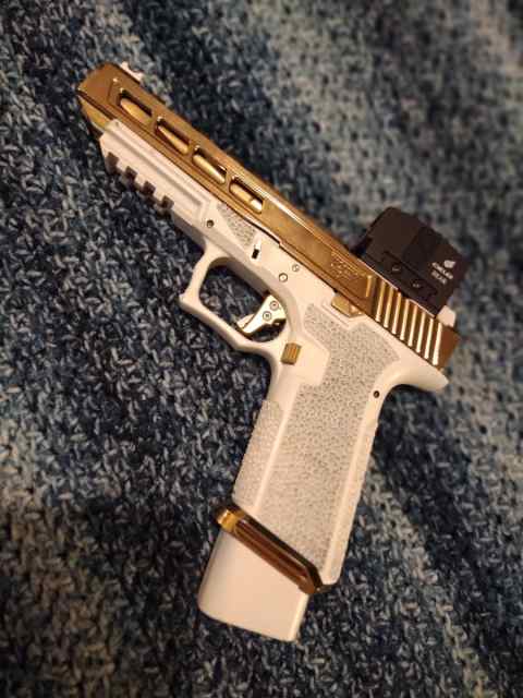 Custom Gold/White Glock 34(trade for running car)